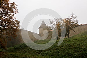 Old medieval fortress Helfstyn in Czech republic in the autumn morning fog