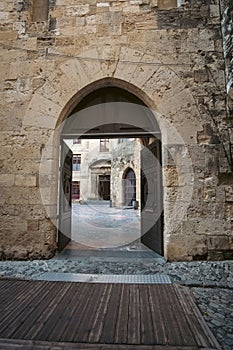 Old medieval gothic gate entrance in Narbonne, France
