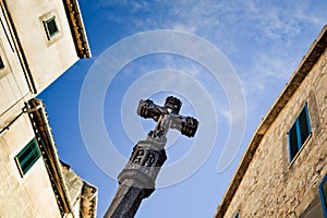 Old medieval Jesus on cross statue in the historic village in Valldemosa on the island Majorca