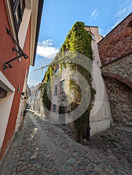 Old medieval narrow street in old town of Riga city, Latvia photo