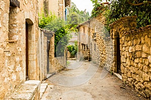 Old medieval street with old houses of charming village Moustiers Sainte Marie, Verdon, Provence, France