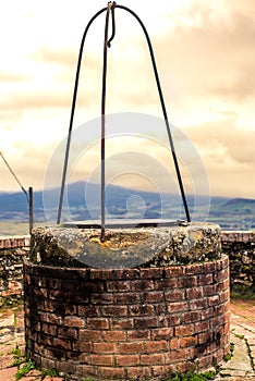 An old medieval water well of a typical medieval small village