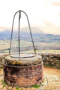 An old medieval water well of a typical medieval small village i
