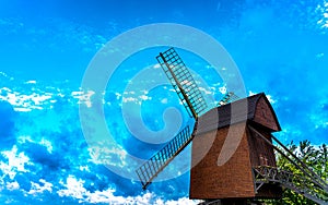 Old medieval wind mill with blue skies