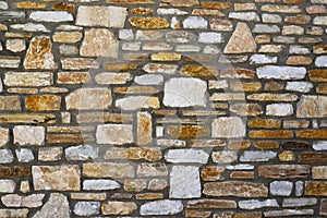 Old mediterranean style stone wall of the house