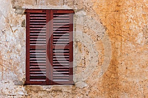 Brown old wood window shutter and rustic wall background