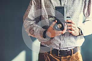 Old medium format camera in photographer hands