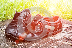 Old men`s shoes. Abandoned on the street after a rain. Worn and