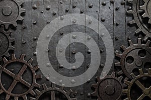 Old metal background with rusty gears and cogs