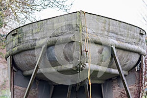 Old metal boat in dry dock for repair