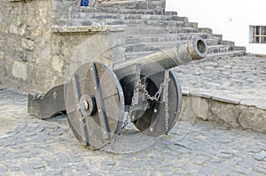 Old metal cannon on the wall of the fortress