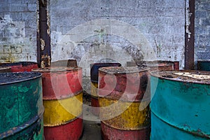 Old metal chemical tanks at sunset sky, dirty oil steel drums, environment, chemical disposal