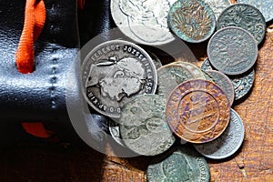 Old metal coins of different countries and years. Macro  shallow depth of field.