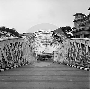 Old metal colonial bridge on the Singapore river in black and white analogue film photography - 1