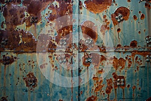 Old metal door detail close up. Grunge rusty metal texture