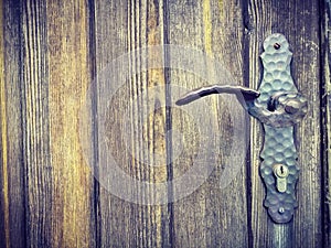 Old metal doorknob on a wooden door in the charming little town of Frohnleiten in the district of Graz-Umgebung, Styria region,