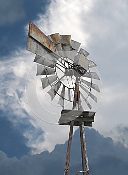 Old metal farm windmill .