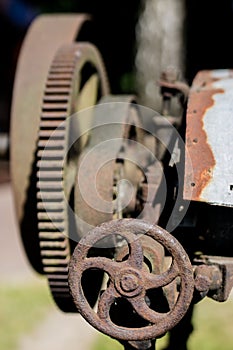 Old metal gears in drive mechanisms. Rusty gears used in machine