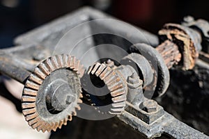 Old metal gears in drive mechanisms. Rusty gears used in machine
