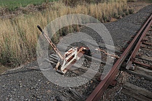 an old metal hand-operated railway track switch lever