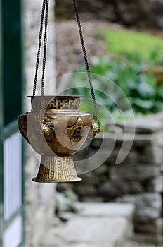 Old metal hanging incense-burner with swastika ornament , Asia