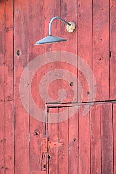 Old lamp over a barn door