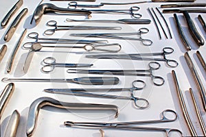 Old metal obstetric, gynecological and urological instruments photo
