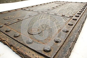Old metal plaque with rivets