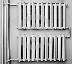 Old metal radiators on wall photo