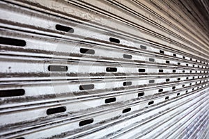 Old metal roller shutter texture background, white color