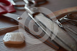 Old metal scissors, chalk, safety pins and tailor measure tape o