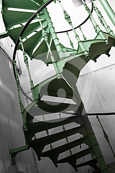 Old metal spiral stair in a factory