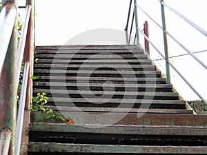 Old metal stairs to the pedestrian bridge