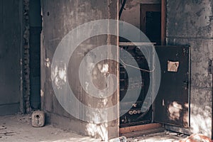 Old metal switchboard, in abandoned crumbling building