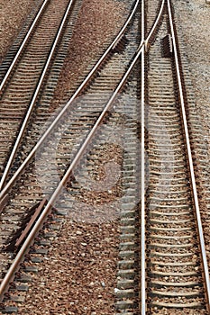 Old metal three railway crossing trains tracks as background