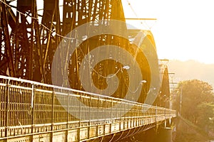 Old metal train bridge during the sunset