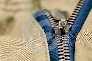 Old metal zipper openning on pants. Selected focus photo