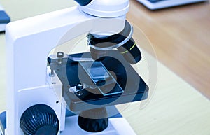 old microscope isolated on white background. concept