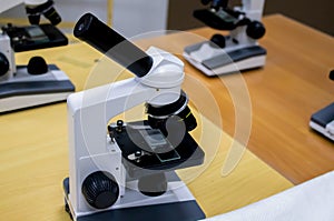 old microscope isolated on white background, concept