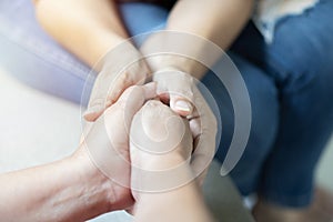 Old middle aged people holding hands close up view, senior retired family couple express care