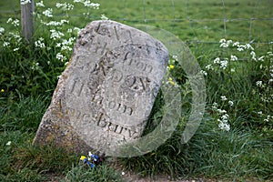 Old milestone at Stonehenge, UK. showing distance to London and Amesbury in roman digits photo
