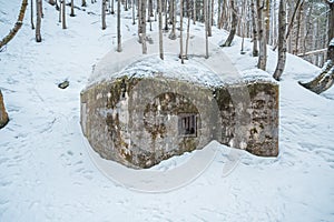 Old military bunker from WWII in winter forest. Located in Czech republic, Krkonose.