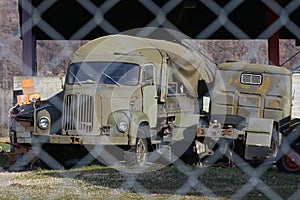 Old military trucks in ruin