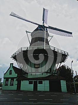 an old mill in Amsterdam in the dark photo