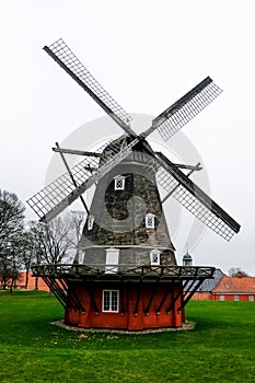 Old mill in Copenhagen operating on wind energy. Traditional danish structure in a historical military citadel called Kastellet.