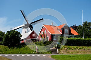 Old mill and cyclist.
