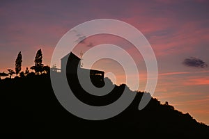 Old mill on a hill at sunset in Greece