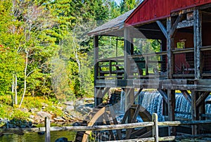 Old Mill Museum, water wheel, millpond and waterfall in historic Weston Village