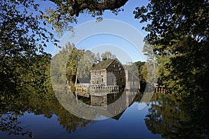 Old Mill reflecting in a pond