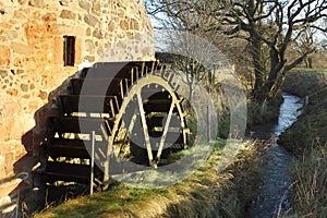 Old mill wheel and stream at Preston Mill